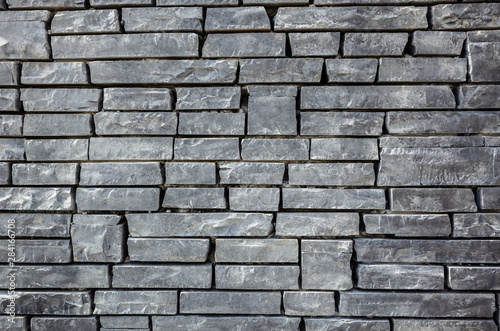 gray brick wall with rough texture