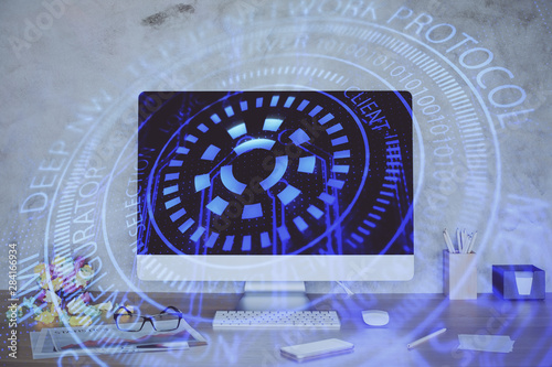 Double exposure of table with computer on background and data theme hologram. Data technology concept.