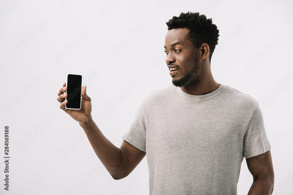 happy african american man looking at smartphone with blank screen isolated on white happy african american man looking at smartphone with blank screen isolated on white