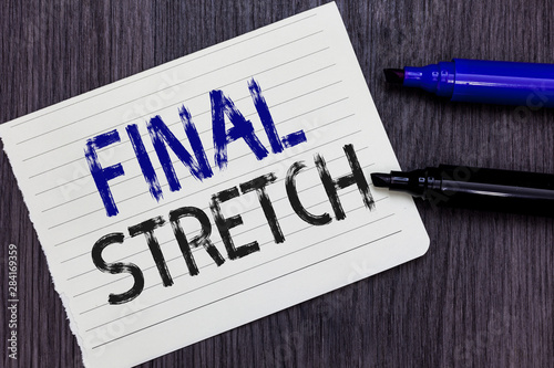 Writing note showing Final Stretch. Business photo showcasing Last Leg Concluding Round Ultimate Stage Finale Year ender Notebook Paper Reminder Communicating ideas Markers Wooden background photo