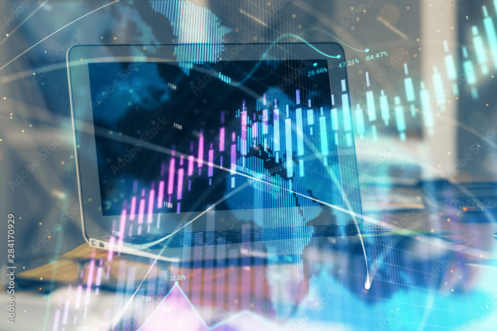 Forex Chart hologram on table with computer background. Double exposure. Concept of financial markets. Forex Chart hologram on table with computer background. Double exposure. Concept of financial markets.