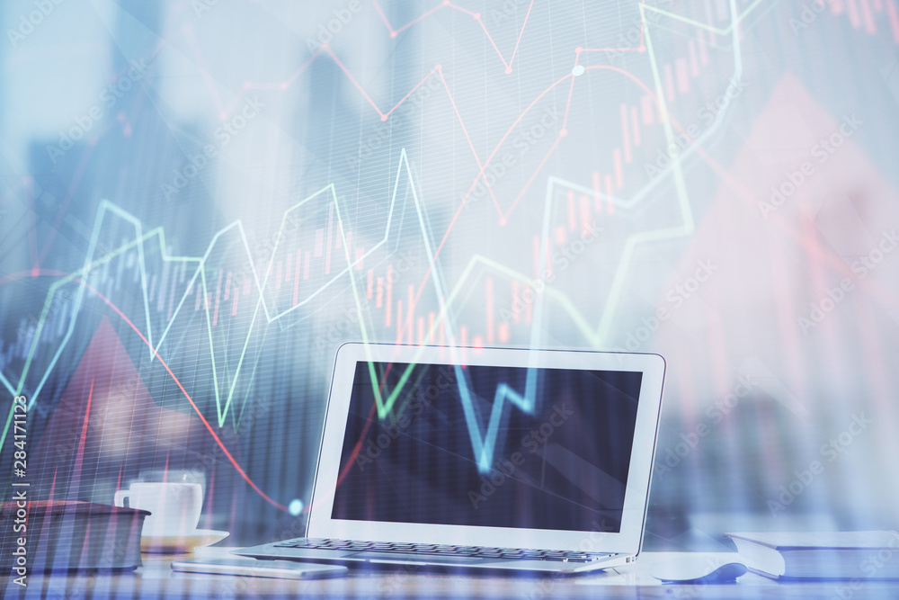 Forex graph hologram on table with computer background. Multi exposure. Concept of financial markets.