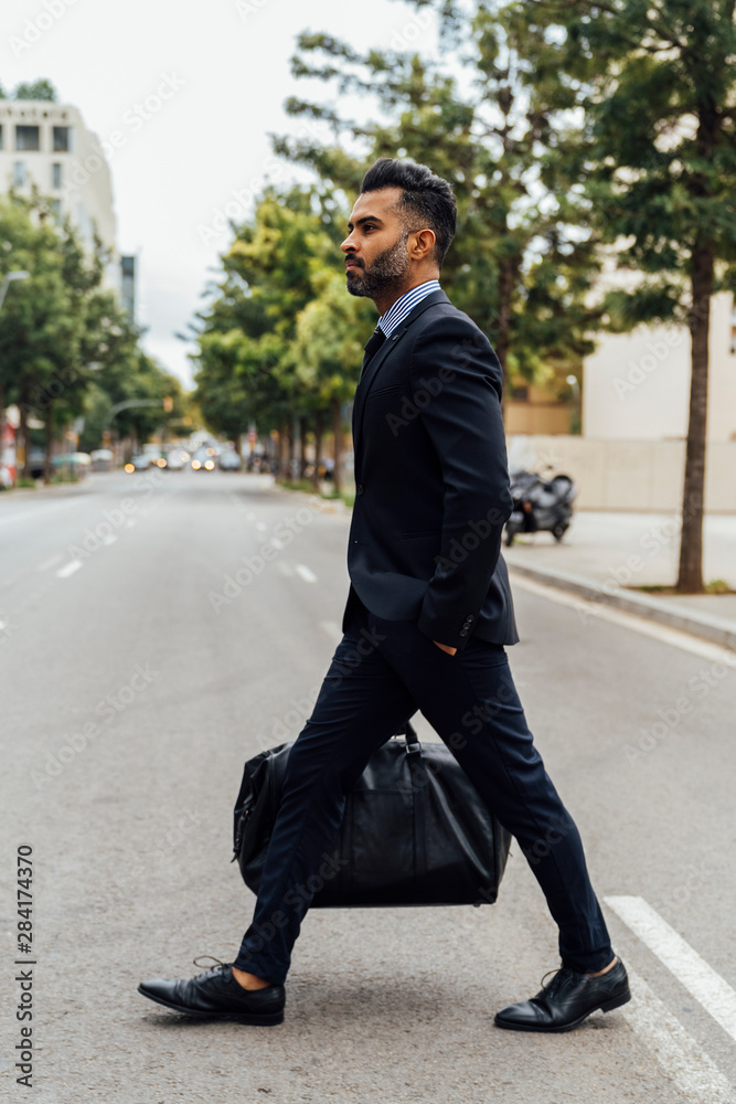 young Elegant Businessman Crossing the Street young Elegant Businessman Crossing the Street