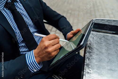 Adult Elegant Indian Businessman Signing a Contract or Taking a photo