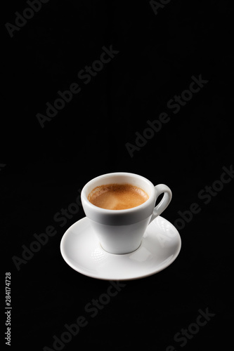 Cup of espresso on black background. 