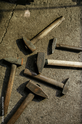 Hammers on concrete background