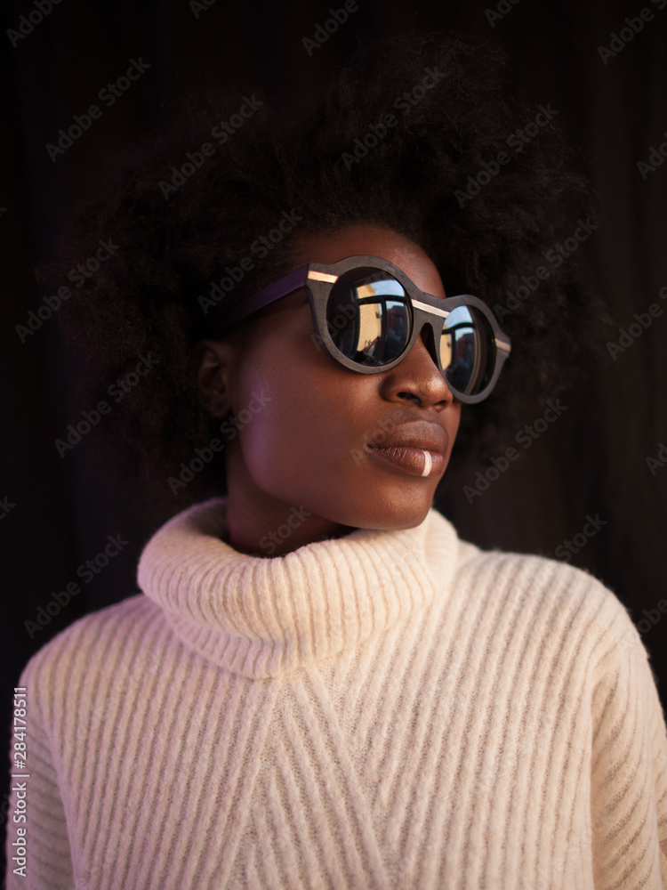 Gorgeous black model in sweater and sunglasses Gorgeous black model in sweater and sunglasses