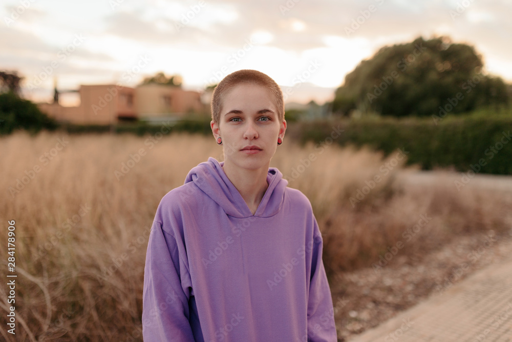 Serious androgyne woman with short hair Serious androgyne woman with short hair