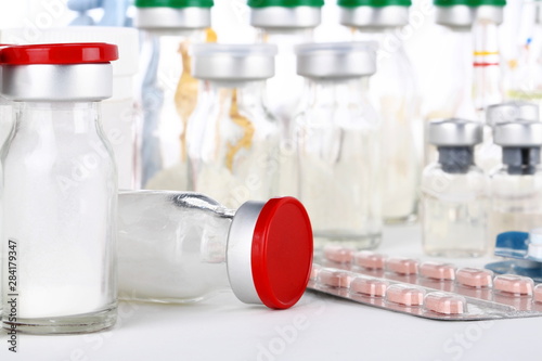 cortisone treatment, syringe and cortisone bottles