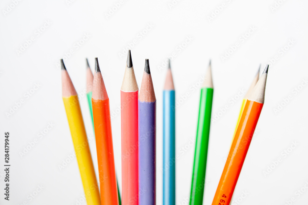 Fototapeta premium colored pencils in the shape of a star on a white background