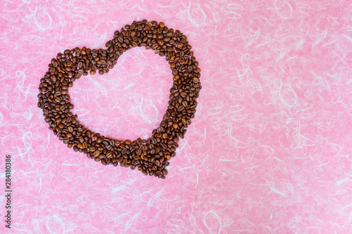Valentine's Day concept. Coffee been on white pink background. Top view with copy space.