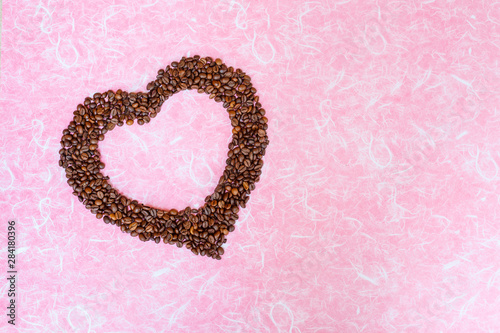 Valentine's Day concept. Coffee been on white pink background. Top view with copy space.