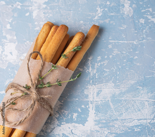 italian stick bread grissini traditional top view blue table copy space photo