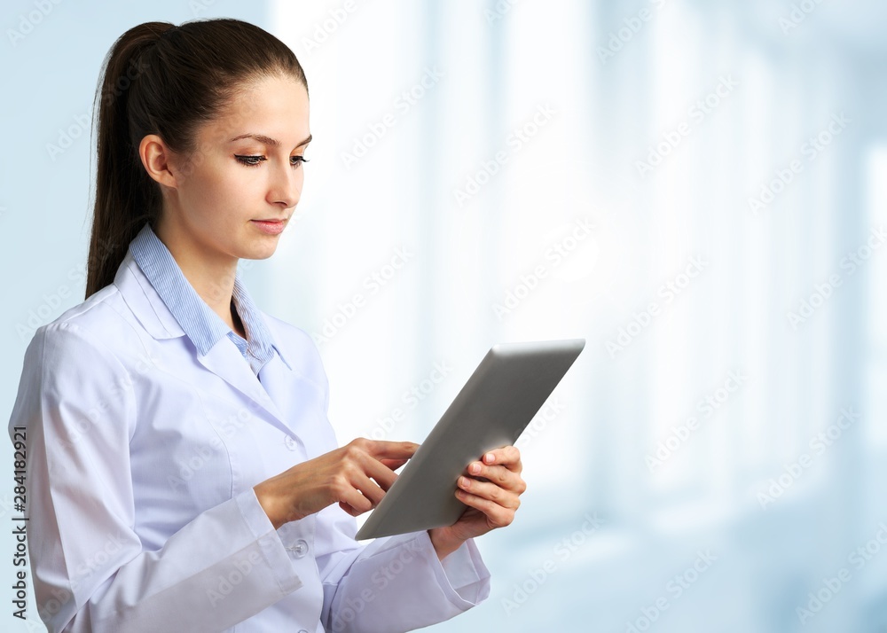 Close-up Doctor at hospital working with tablet pc Close-up Doctor at hospital working with tablet pc
