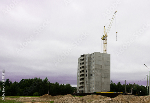 Obraz na plátne New residential building and construction building big hoisting tower crane