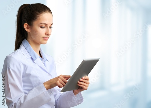 Close-up Doctor at hospital working with tablet pc © BillionPhotos.com