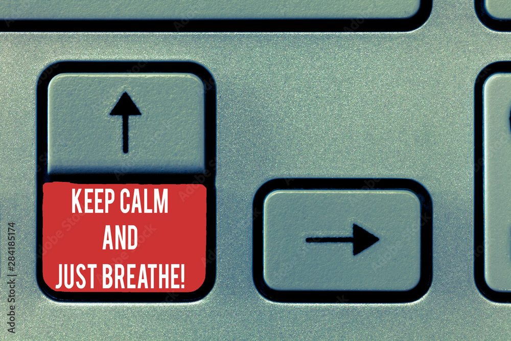 Conceptual hand writing showing Keep Calm And Just Breathe. Business photo text Take a break to overcome everyday difficulties Keyboard Intention to create computer message keypad idea