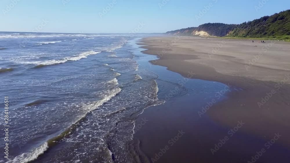Overheard aerial of waves crashing on a beach. Overheard aerial of waves crashing on a beach.