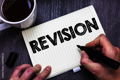 Text sign showing Revision. Conceptual photo Rechecking Before Proceeding Self Improvement Preparation Black coffee white cup paper marker pen thoughts creative black wood photo