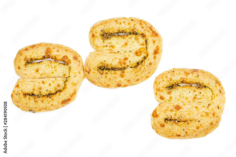 Group of three whole crisp savory cheese palmier flatlay isolated on white background