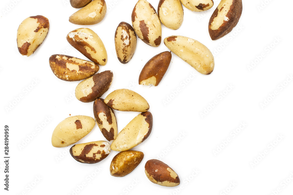 Lot of whole unshelled brazil nut flatlay isolated on white background Lot of whole unshelled brazil nut flatlay isolated on white background