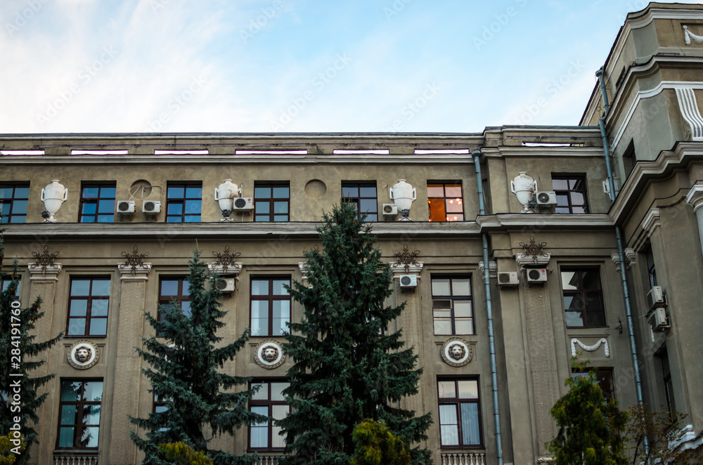 Fototapeta premium Historic old building with one burning window