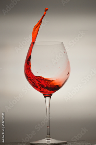 wine glass splashing on background