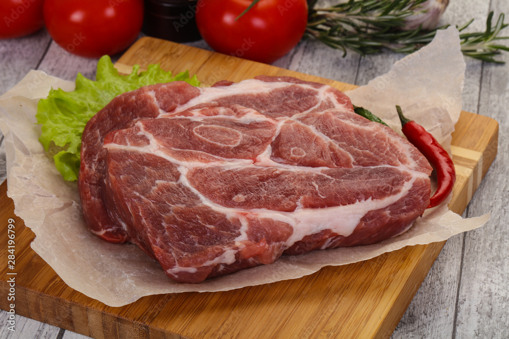 Raw pork neck steak