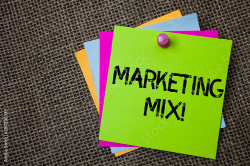 Handwriting text writing Marketing Mix Motivational Call. Concept meaning Actions to promote brand product in market Sticky cards board pinned muliple colours remember idea jute background photo