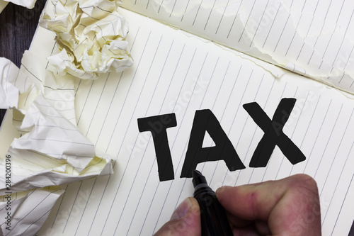 Conceptual hand writing showing Tax. Business photo showcasing Compulsory payment of taxes by people to government increase revenue Paper object notepad crumpled papers ideas several tries