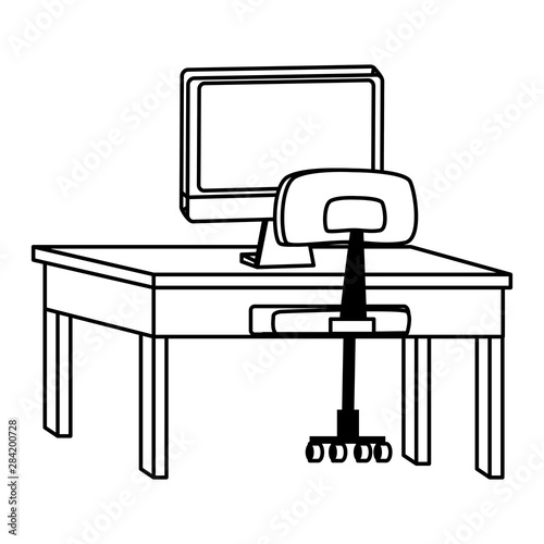 computer on desk with office chair in black and white
