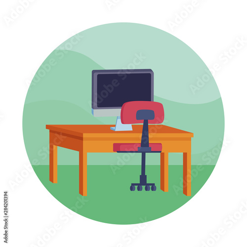 computer on desk with office chair