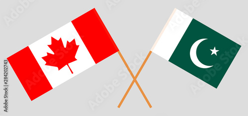 Pakistan and Canada. Crossed Pakistani and Canadian flags