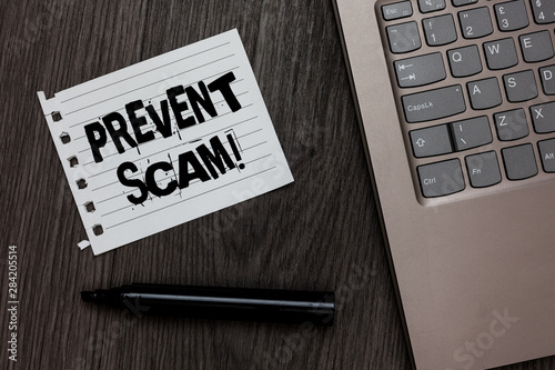 Word writing text Prevent Scam Motivational Call. Business concept for Consumer protection fraudulent transactions Laptop nice computer notebook netbook pen small pitch paper pen wood