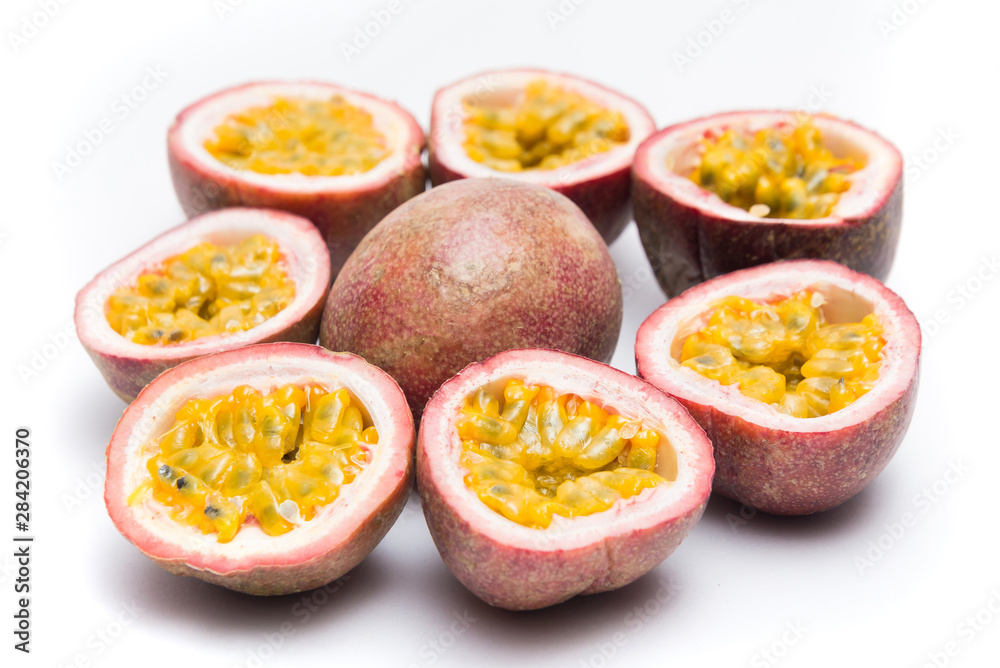 Half cut passion fruit isolated on white background, sour fruit, fruit background, healthy food Half cut passion fruit isolated on white background, sour fruit, fruit background, healthy food