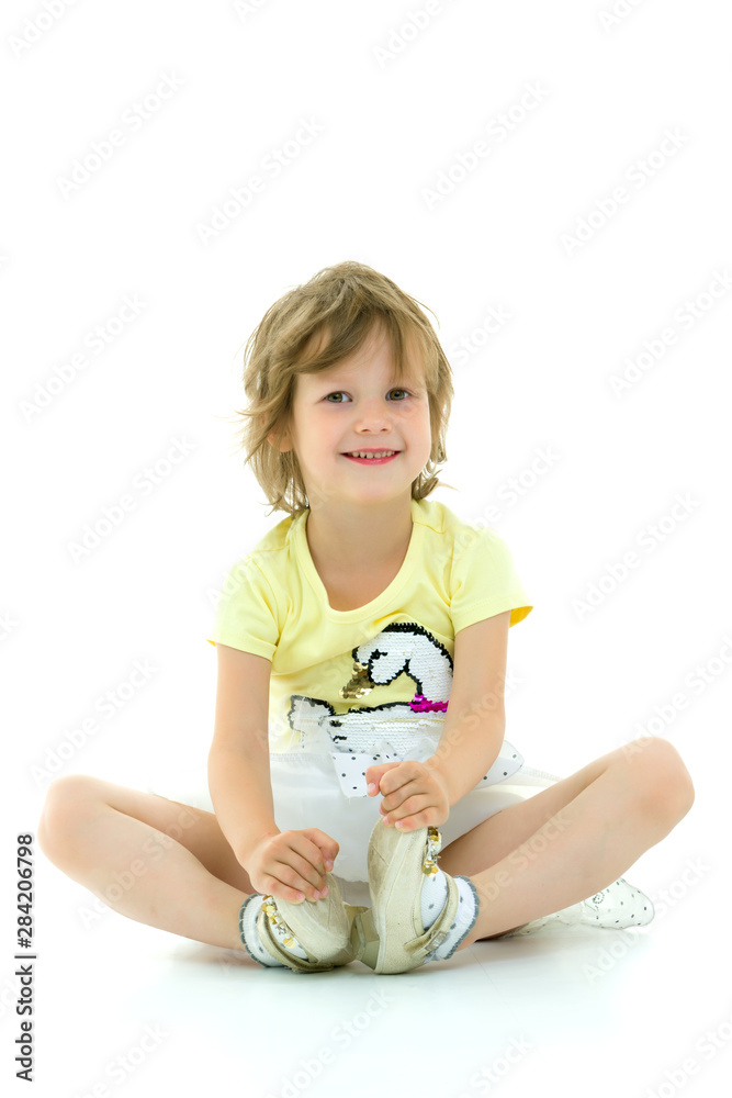Charming little girl doing gymnastic exercises in the studio on Charming little girl doing gymnastic exercises in the studio on