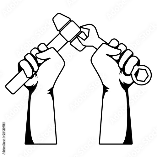 Construction workers hands holding tools in black and white
