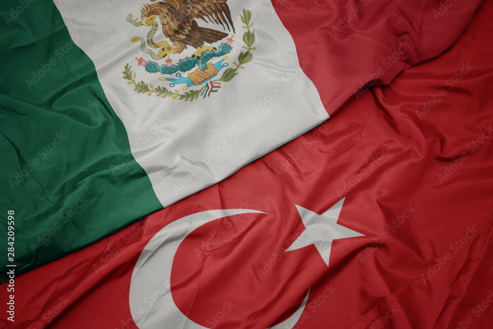 waving colorful flag of turkey and national flag of mexico. waving colorful flag of turkey and national flag of mexico.