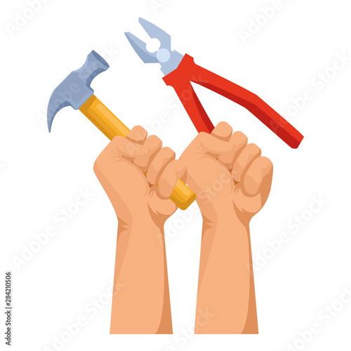 Construction workers hands holding tools