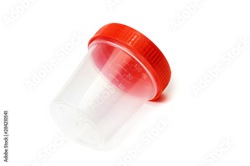 empty plastic urine jar isolated on red background. close up