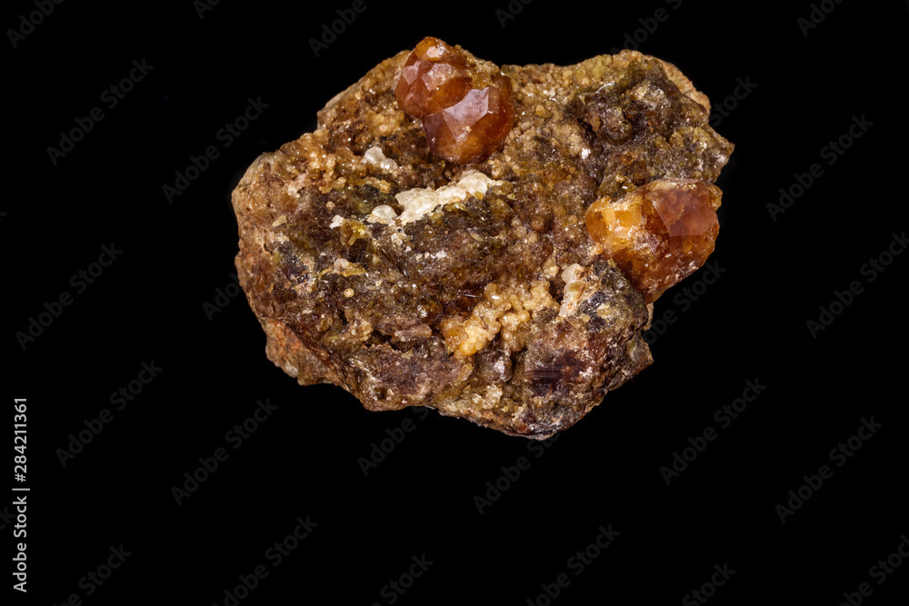 macro mineral stone Grossular, Garnet, Epidote on a black background macro mineral stone Grossular, Garnet, Epidote on a black background