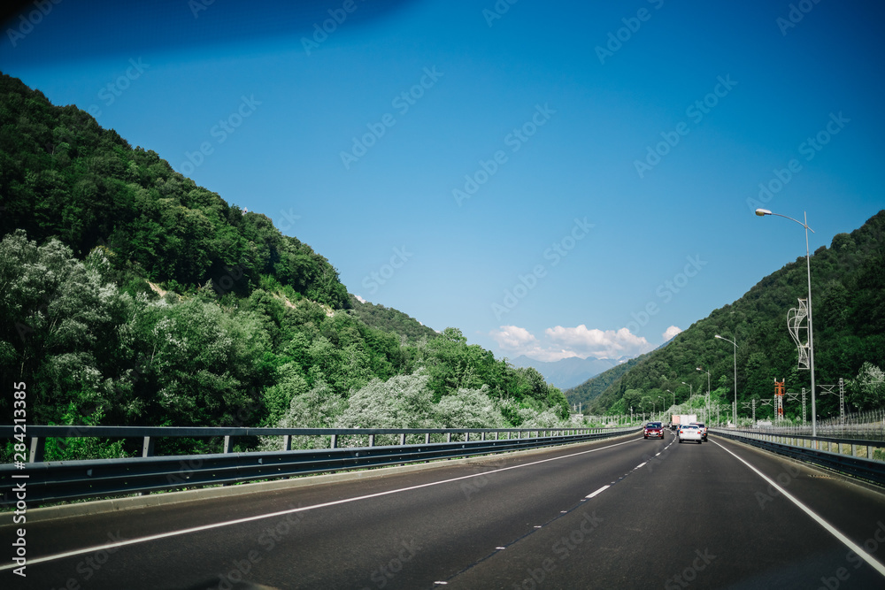 road in mountains summer forest sky