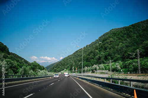 road in mountains summer forest sky