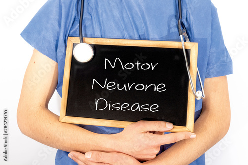 Doctor shows information on blackboard: motor neurone disease.  Medical concept.