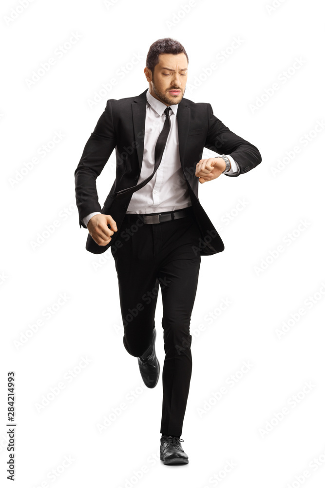 Young professional man in a suit running late Young professional man in a suit running late