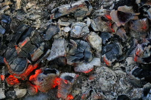 Decaying coals for cooking and a background.