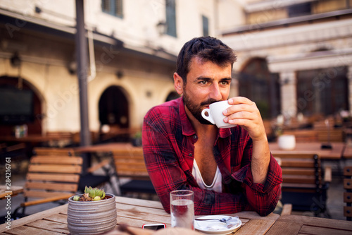 Man in shirt drinking coffee