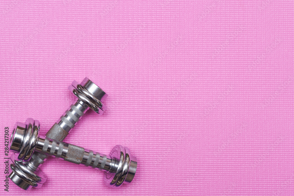 Yoga mat and excercise equipment for gym training and lifting weights with dumbbells Yoga mat and excercise equipment for gym training and lifting weights with dumbbells