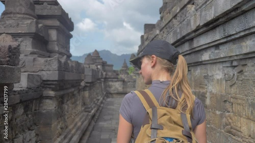 ourist backpacker exploring the Borobudur temple in Java island,Indonesia photo