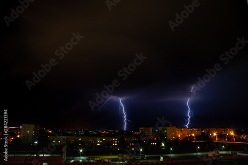Double lightning above city